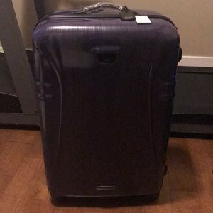 Purple Tumi large hard case